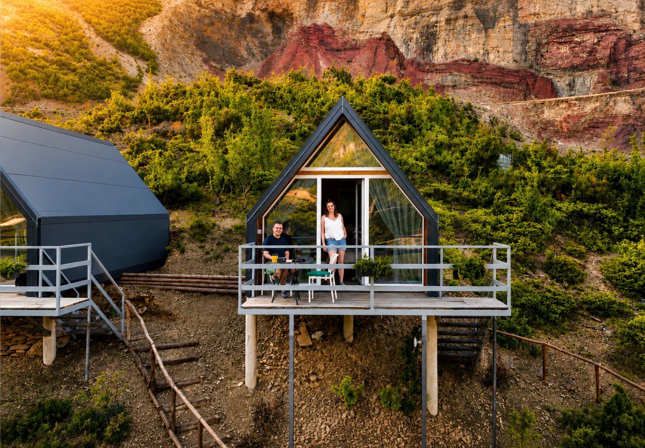 Panorama A-frame cabin perched above Koman Lake at sunset, Albanian Alps